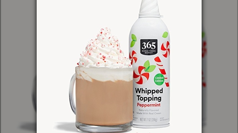 Peppermint whipped cream next to hot chocolate