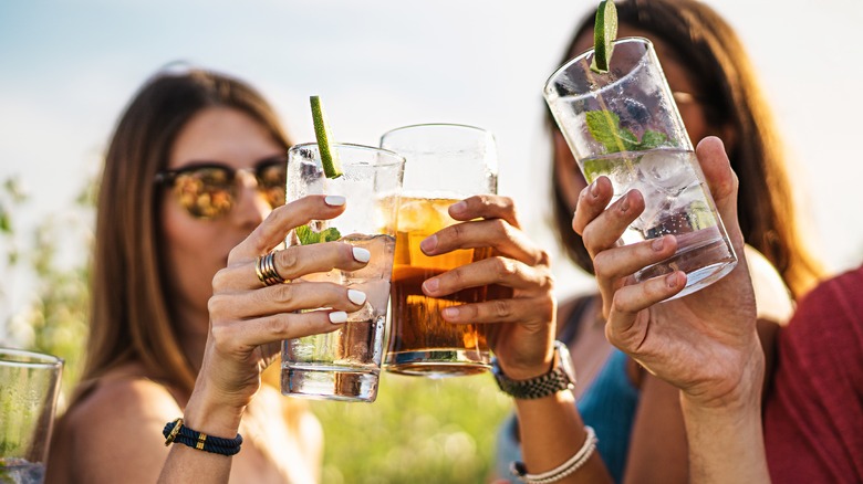 women clinking glasses together