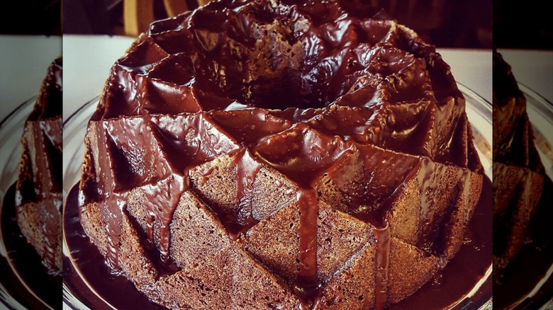 Chocolate bundt cake on glass platter