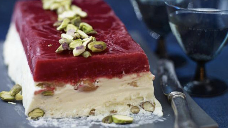 Nougat terrine with raspberry gelée and pistachios