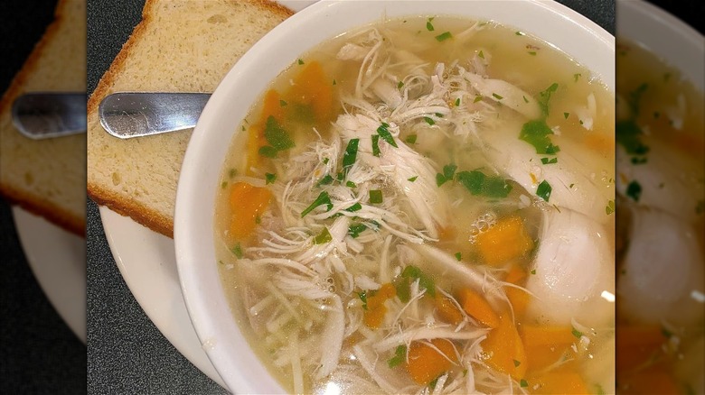 Chicken soup bowl with bread