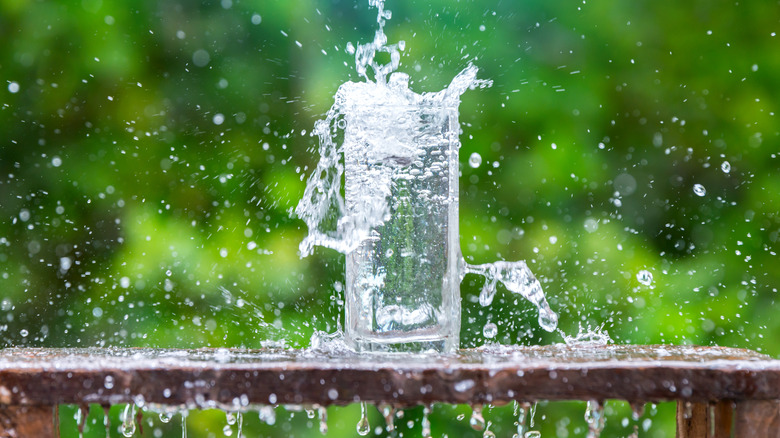 Water splashing into glass