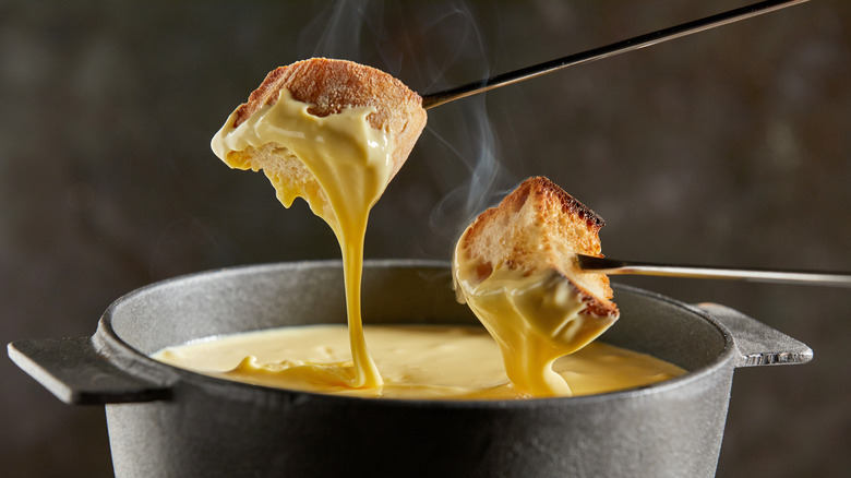 Hot cheese fondue in pot