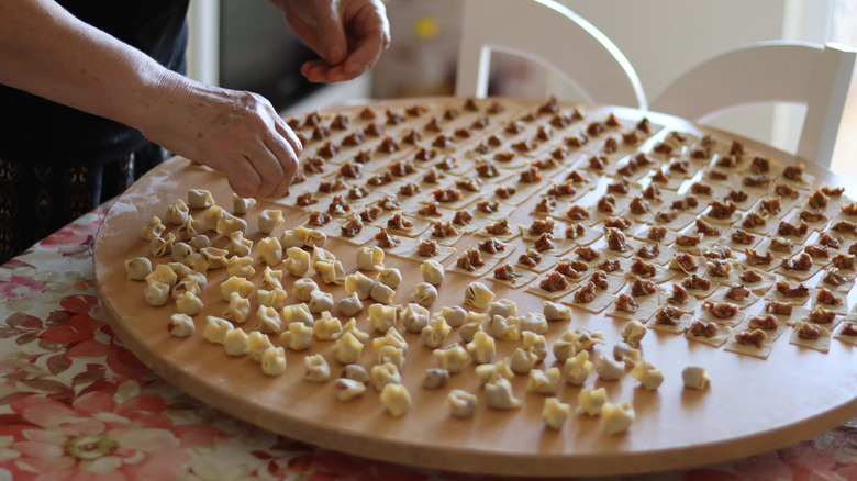 Hands folding Turkish manti