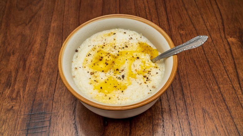 A bowl of grits with melted butter