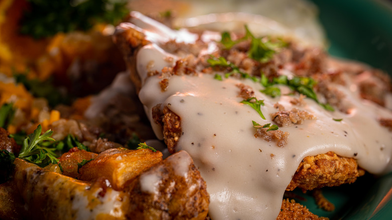 A friend chicken steak with gravy