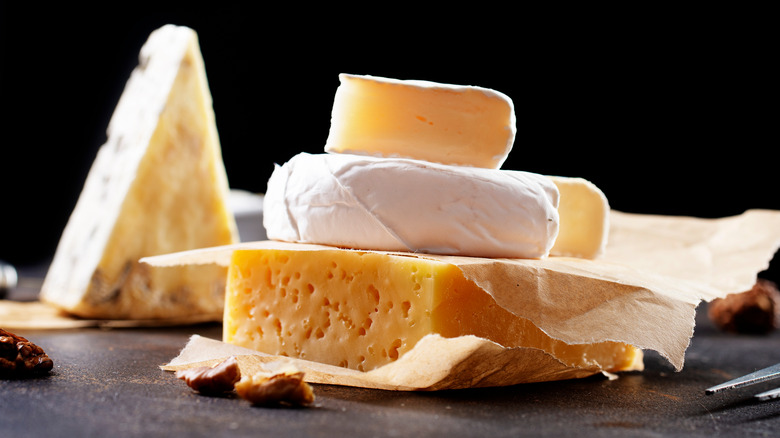 various cheeses on display