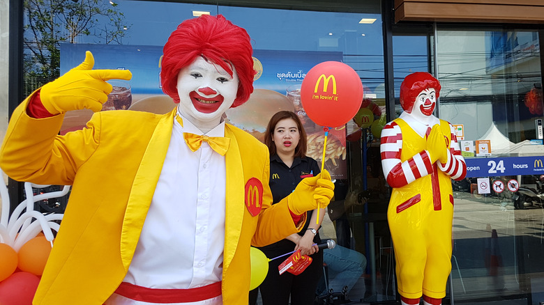 Ronald McDonald with his statue