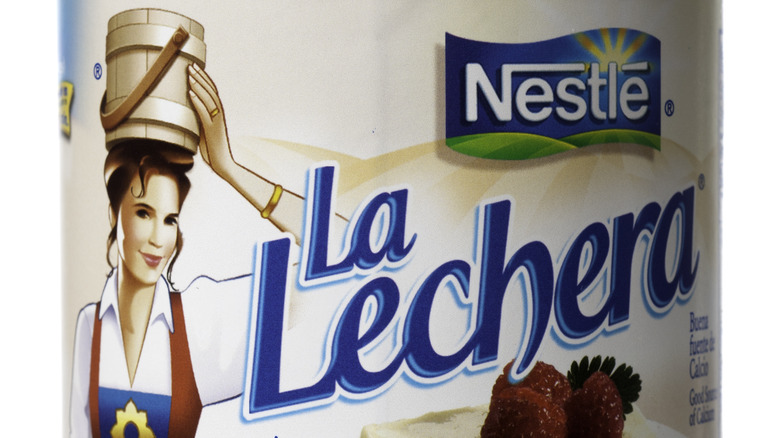 La Lechera can featuring milkmaid mascot
