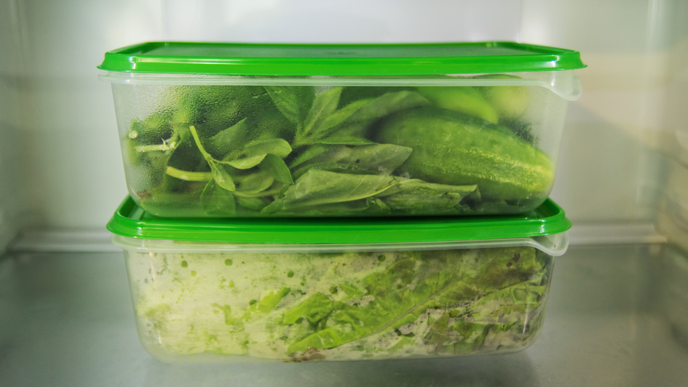 Leftovers in plastic containers in a refrigerator