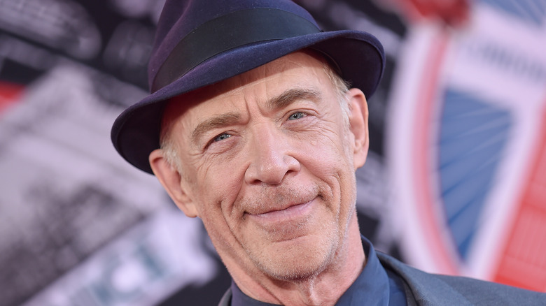 jk simmons smiling in a hat