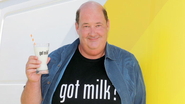 Brian Baumgartner holding milk glass