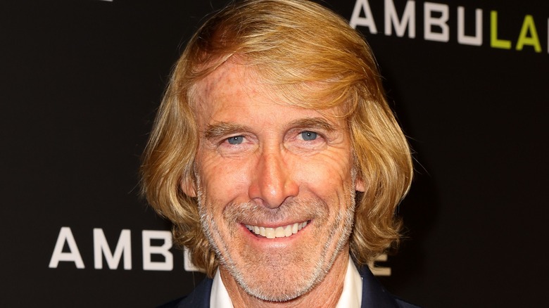 Michael Bay smiling while posing