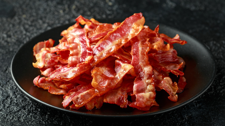 Cooked bacon slices on plate