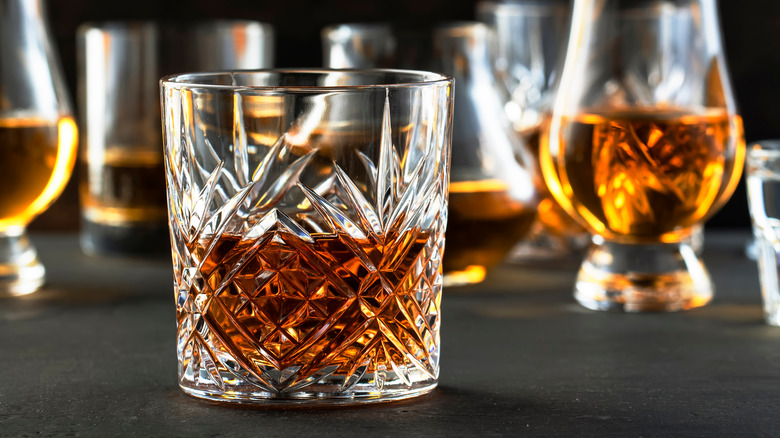 Tumblers and snifters of bourbon