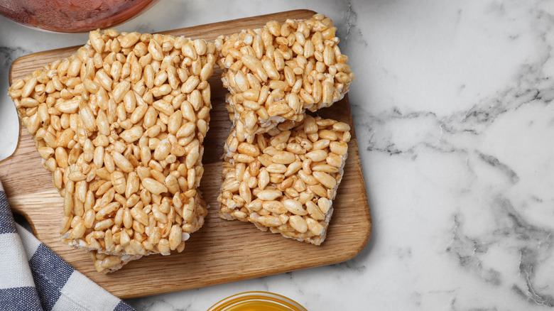 Rice Krispies treats on wooden cutting board