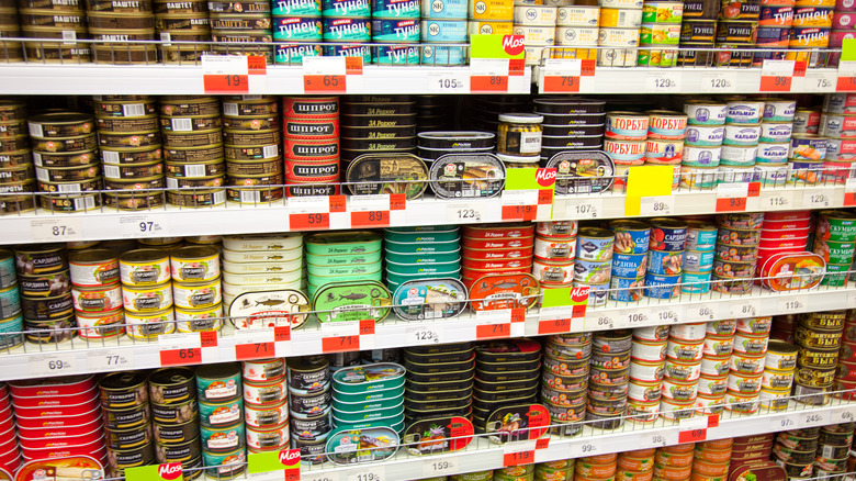 shelves stocked with canned fish