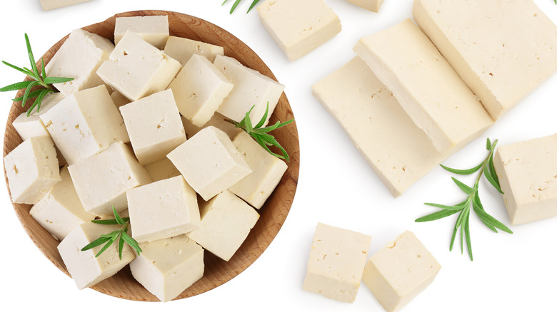 Cubes of tofu in a bowl with rosemary