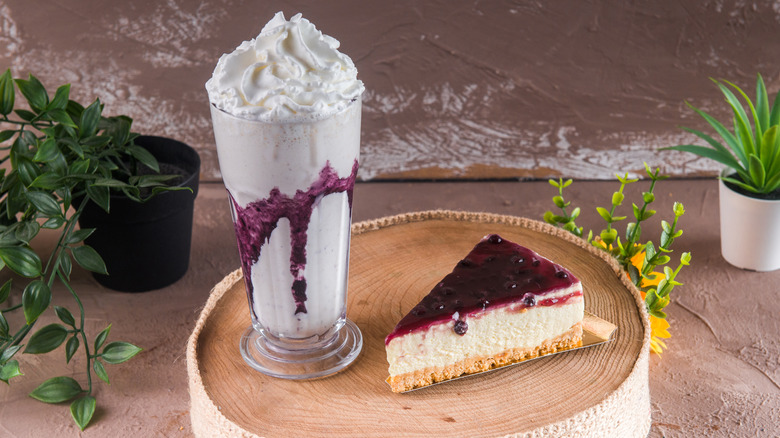 blueberry milkshake with slice of cheesecake