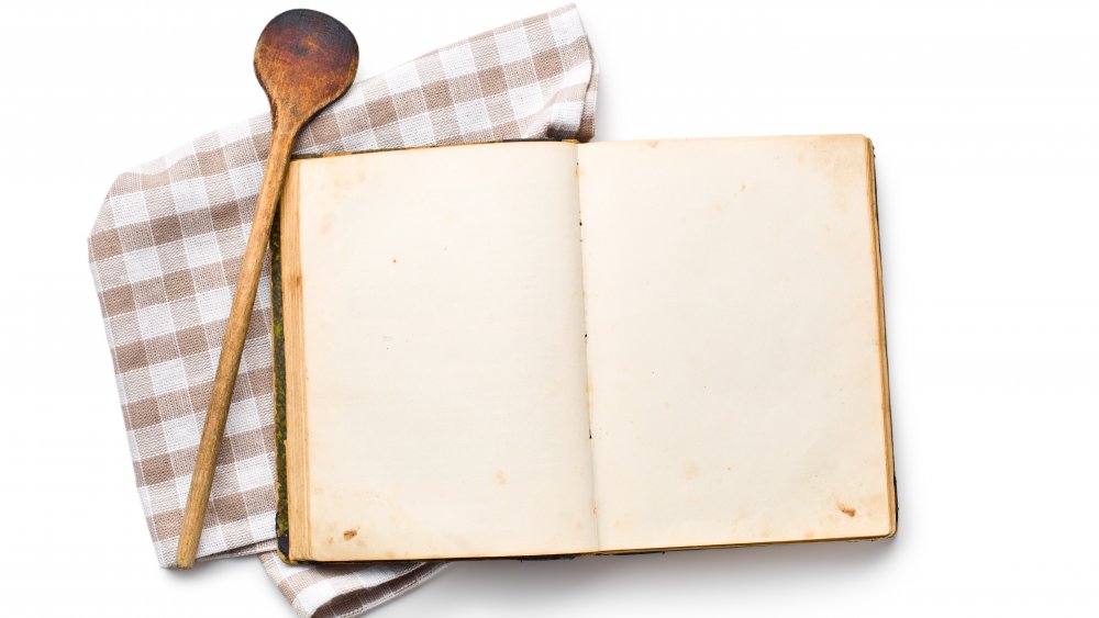 open recipe book on a white background