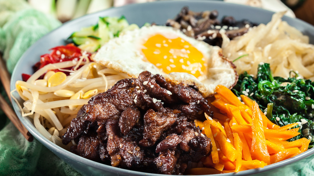 Bibimbap bowl with meat vegetables and egg