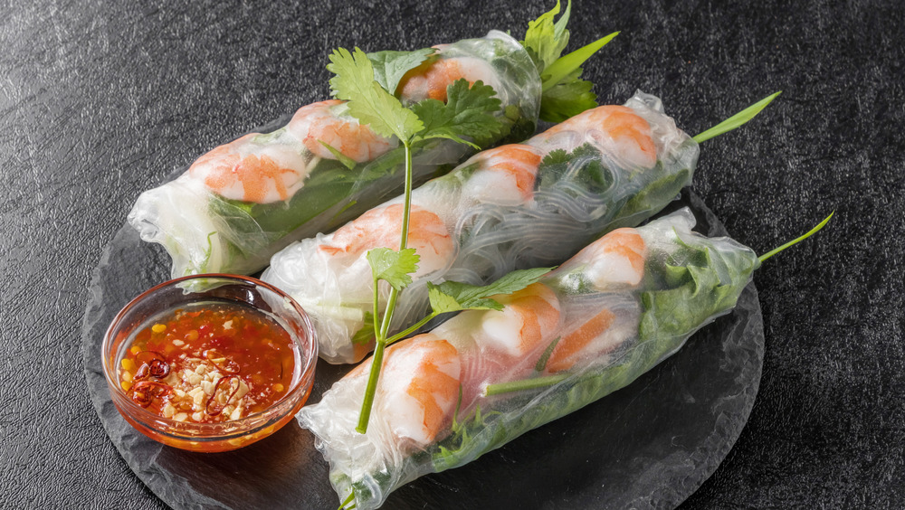 Spring rolls on slate with sauce