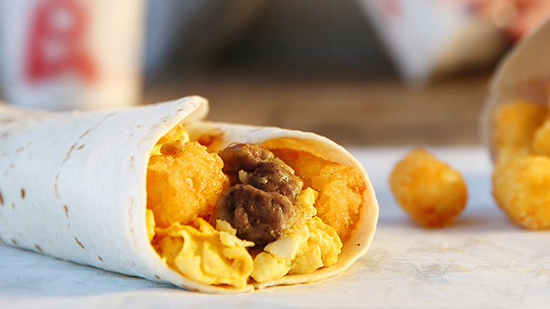 Sonic burrito and tots on a wrapper 