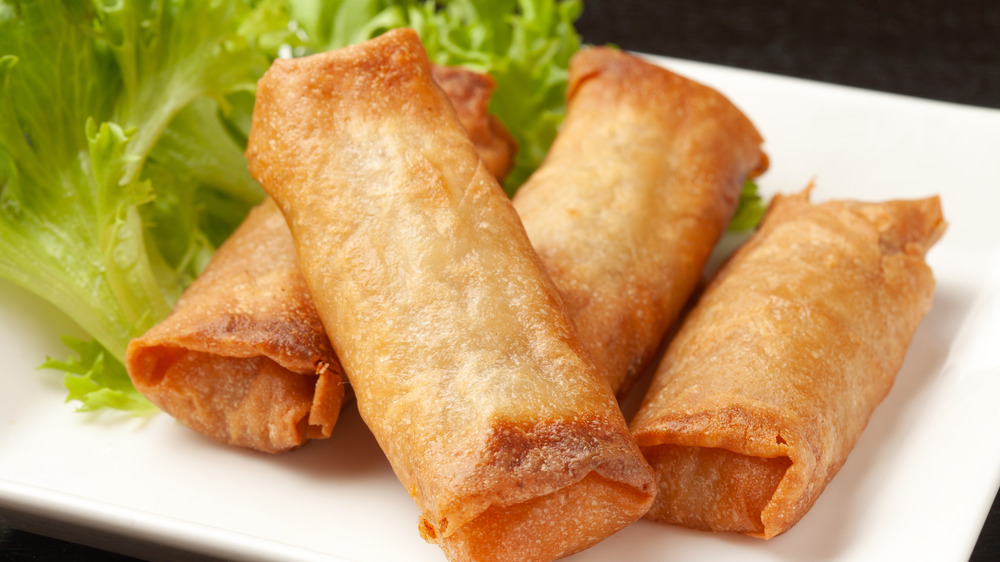 Fried egg rolls on a white plate