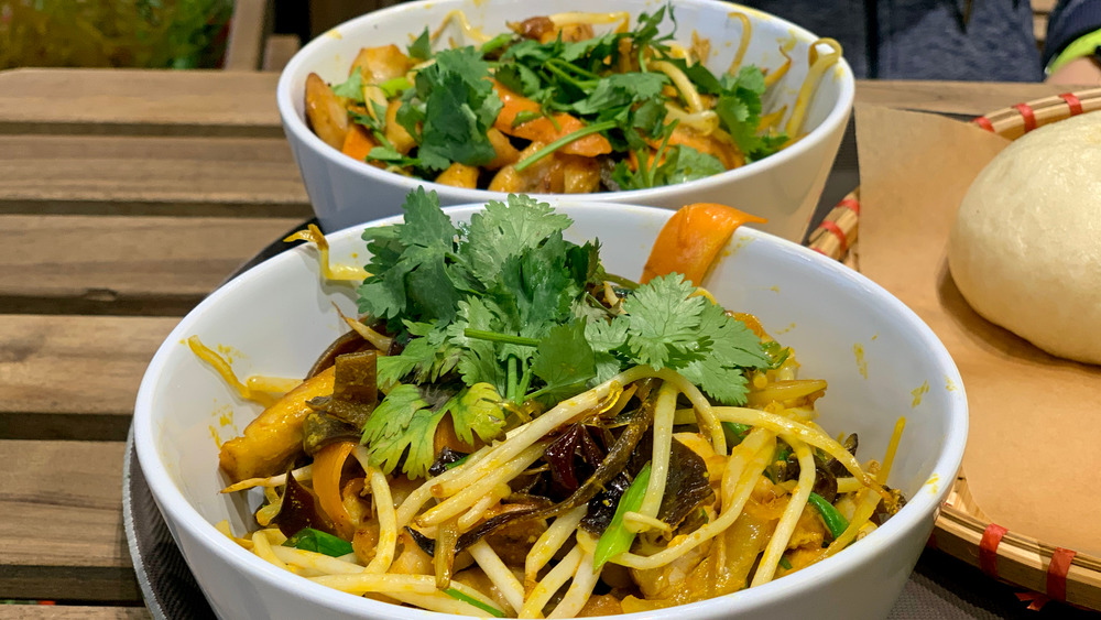 White bowls filled with glass noodle soup