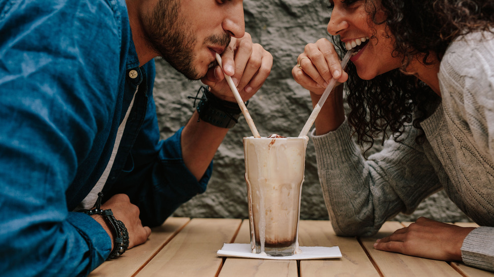 People drinking milkshakes together