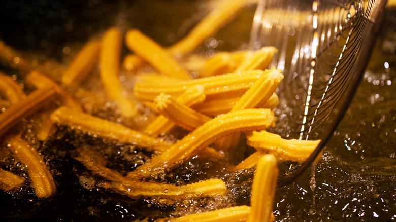 Churros frying in oil