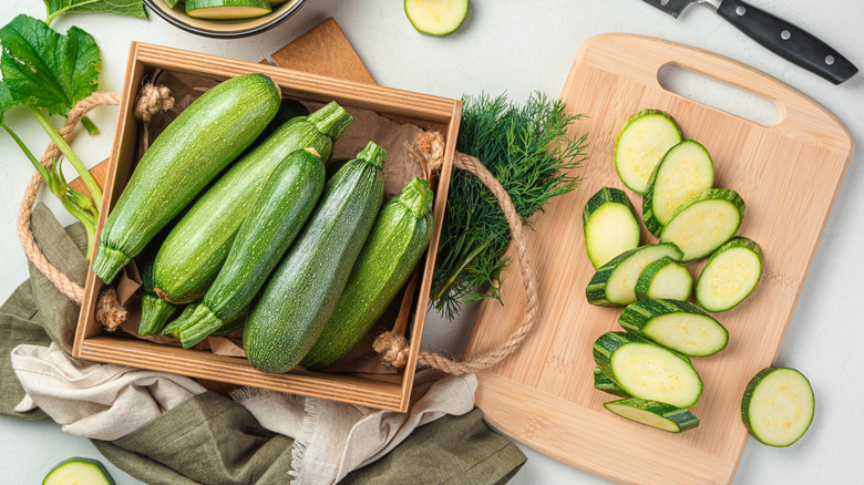 Tray of zucchinis with chopped zucchini slices