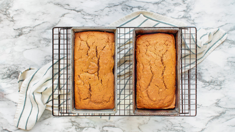 two pumpkin loaves cooling