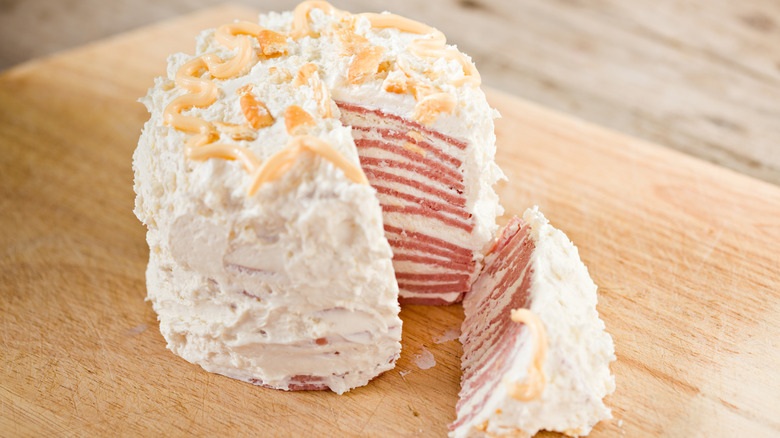 sliced bologna cake on wooden table