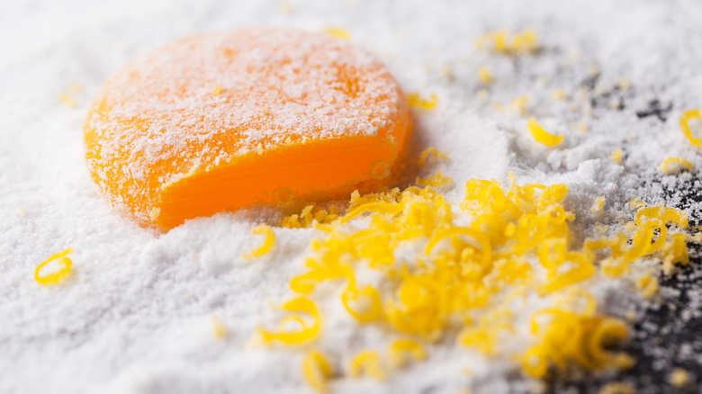 Cured egg yolk with grated pieces. 