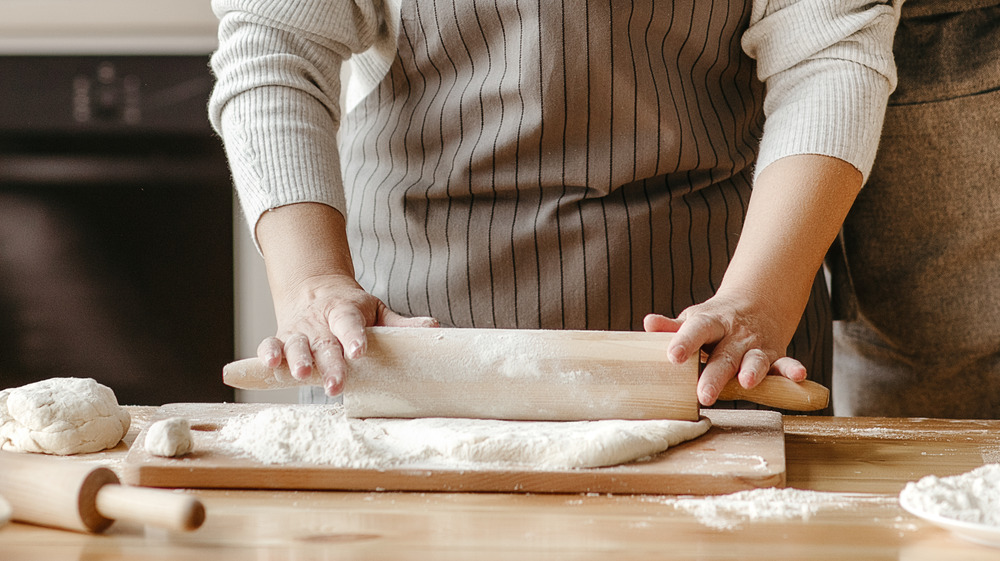 Woman rolling dough 