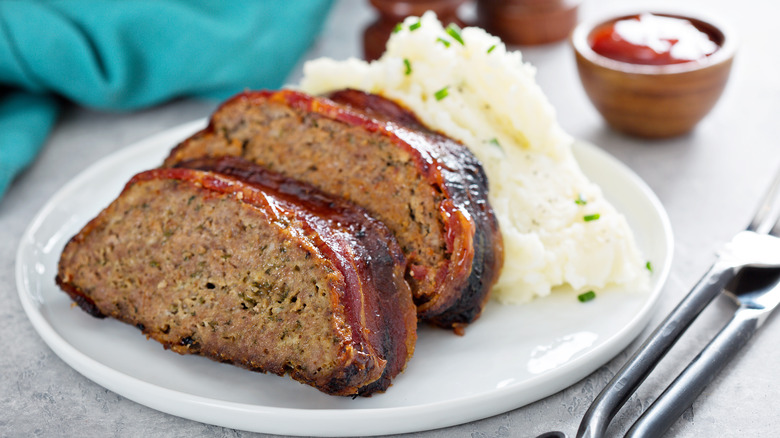 Meatloaf on a plate with mashed potatoes