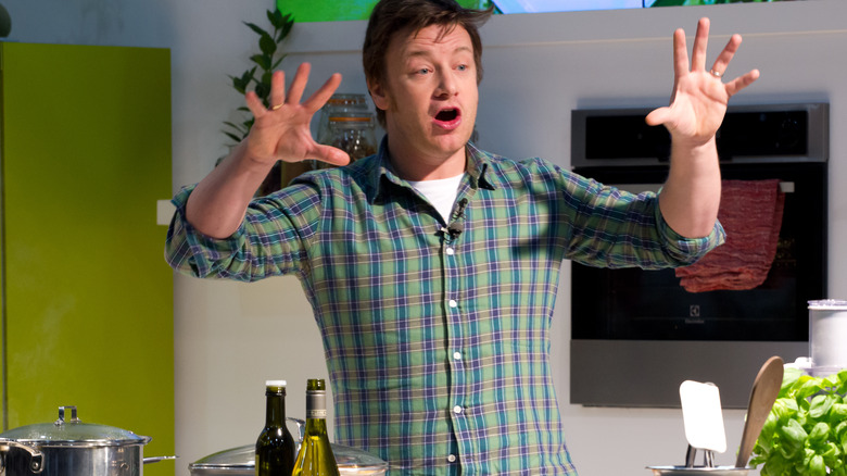 Jamie Oliver extending hands forward