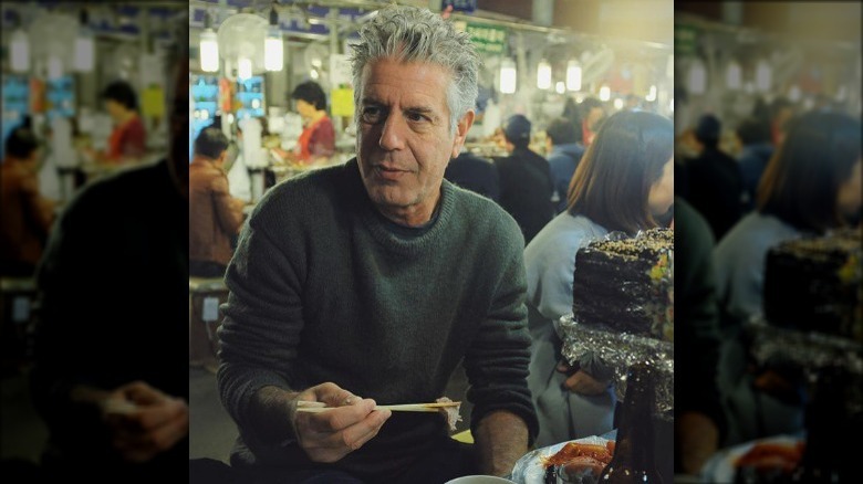 anthony bourdain eating with chopsticks