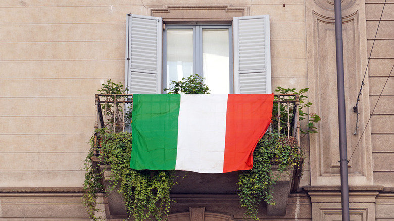 Italian flag hanging over balcony