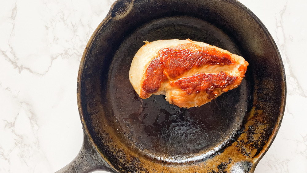 seared chicken breast in cast iron skillet