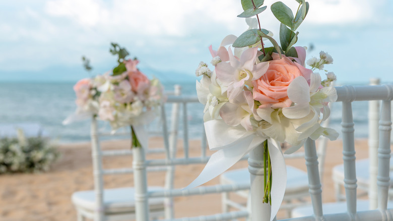 Chairs set up on beach for wedding