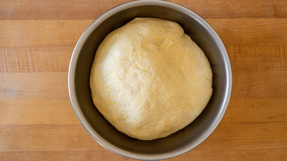 pizza dough rising for deep dish pizza recipe