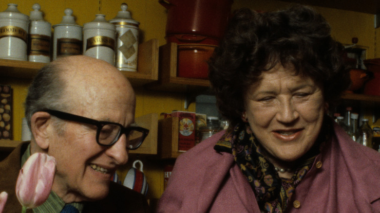 Paul and Julia Child in a kitchen