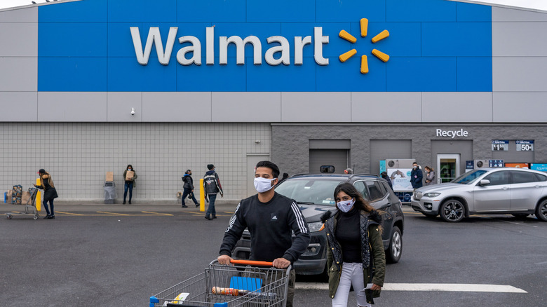 Walmart storefront with shoppers outside