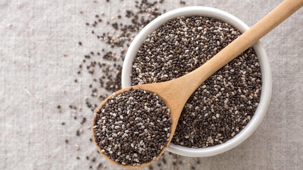 chia seeds in bowl with wooden spoon