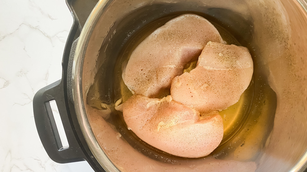 chicken and broth in Instant Pot