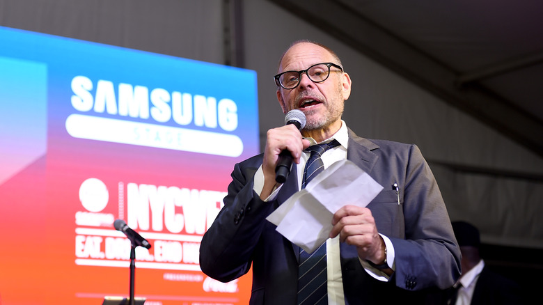 Alton Brown speaking at event