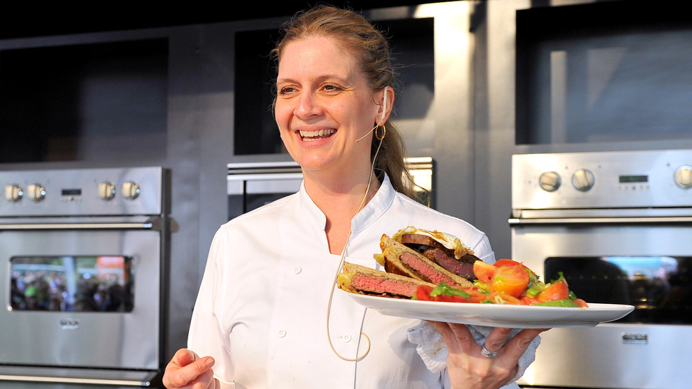 Amanda Freitag holding plate of food