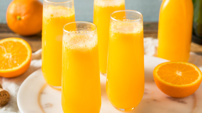 Mimosas with sliced oranges